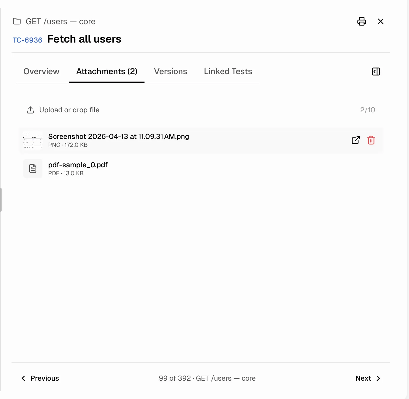 Attachments tab showing uploaded files with drag-and-drop upload area